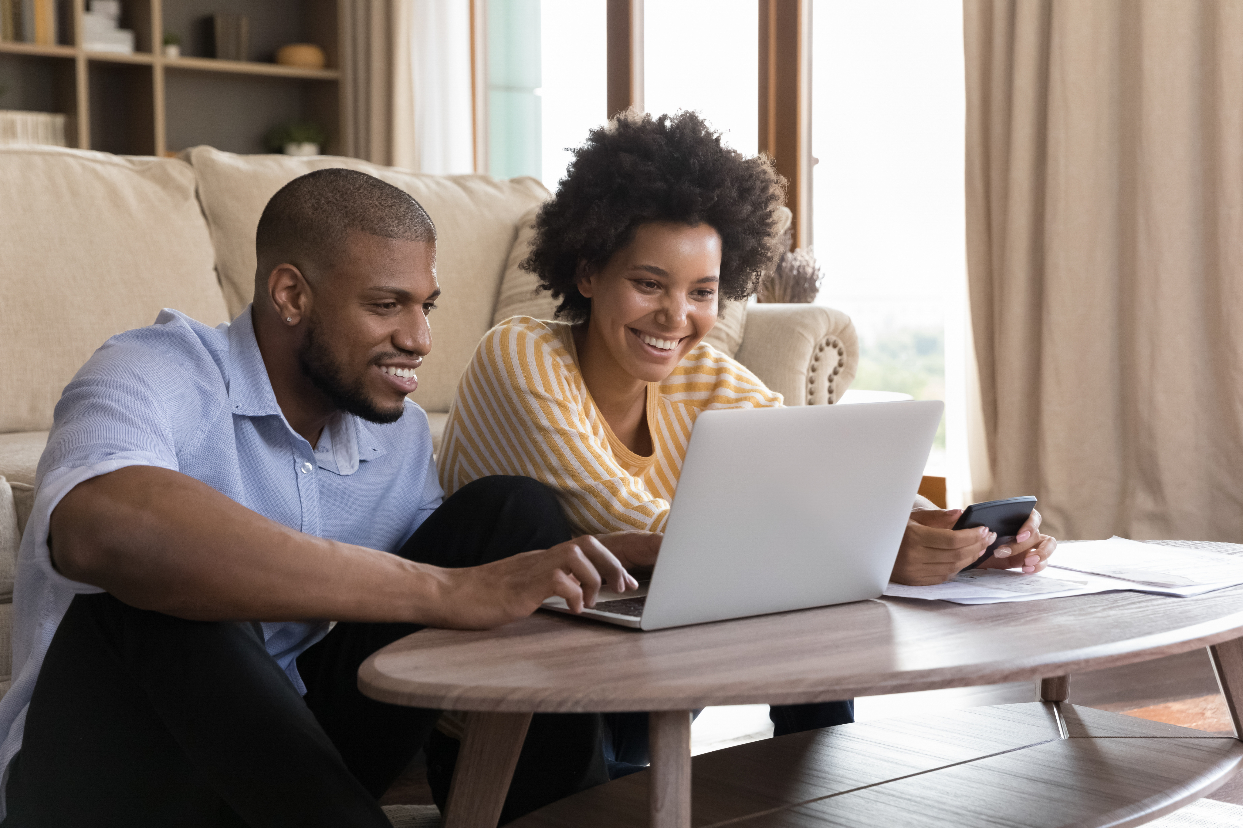 Man and woman using a laptop