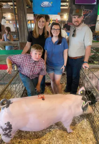 People and a pig