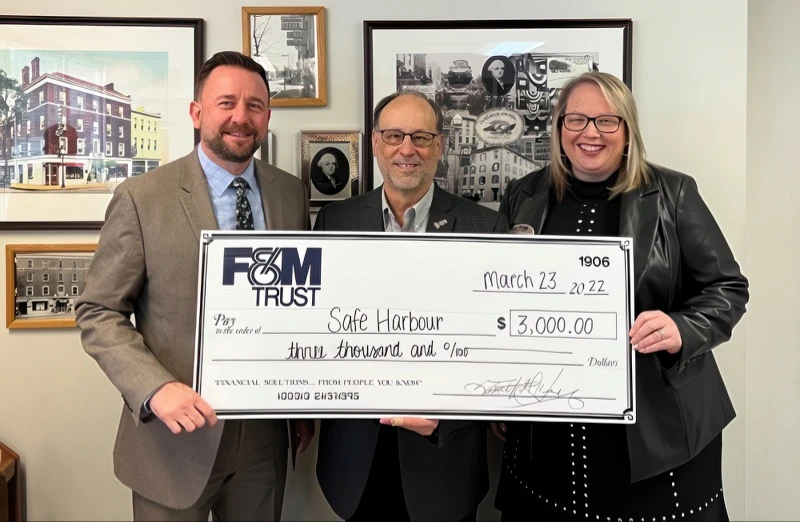 bank reps present large check to program rep
